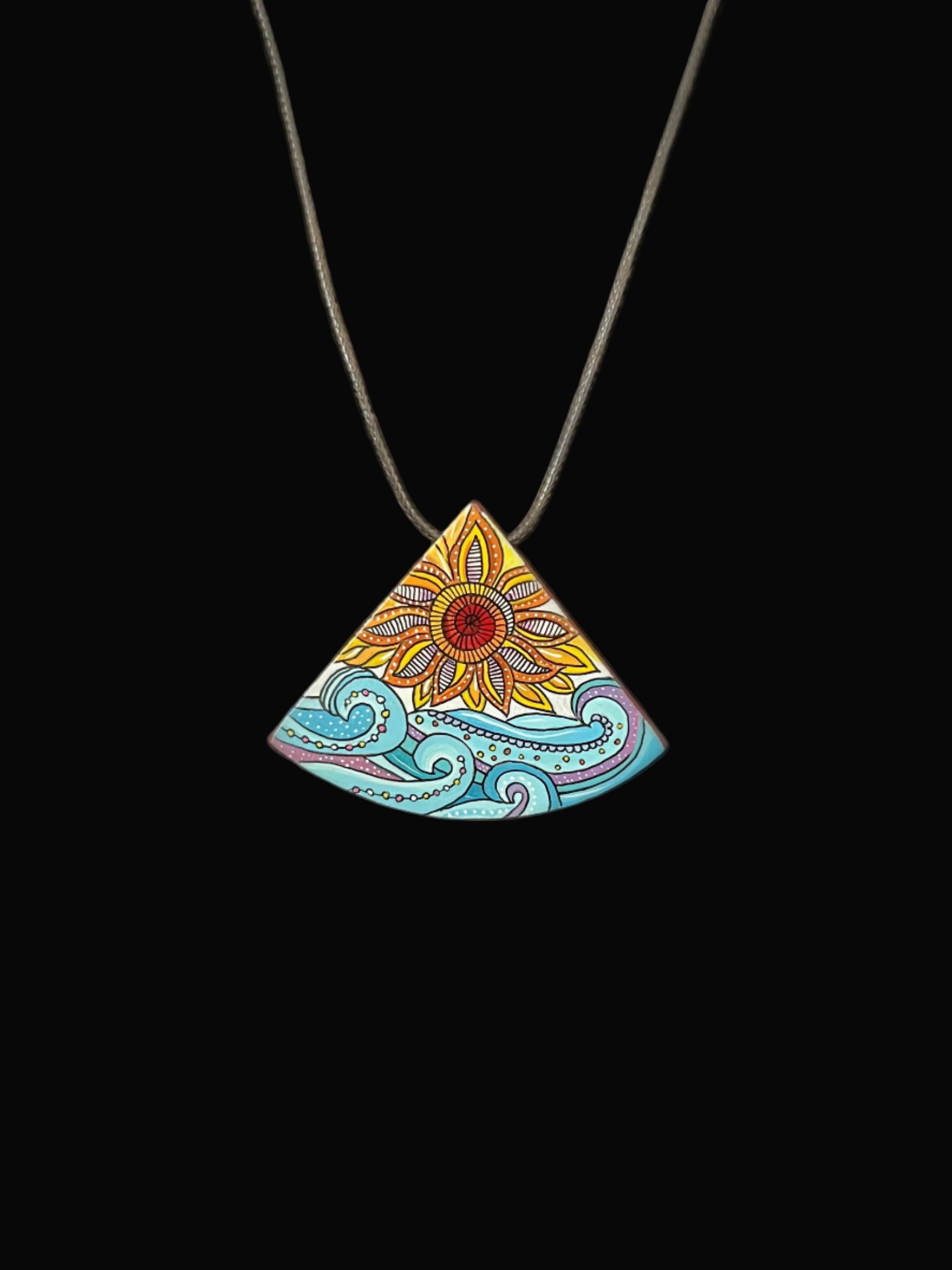 Colorful triangular pendant with floral design 