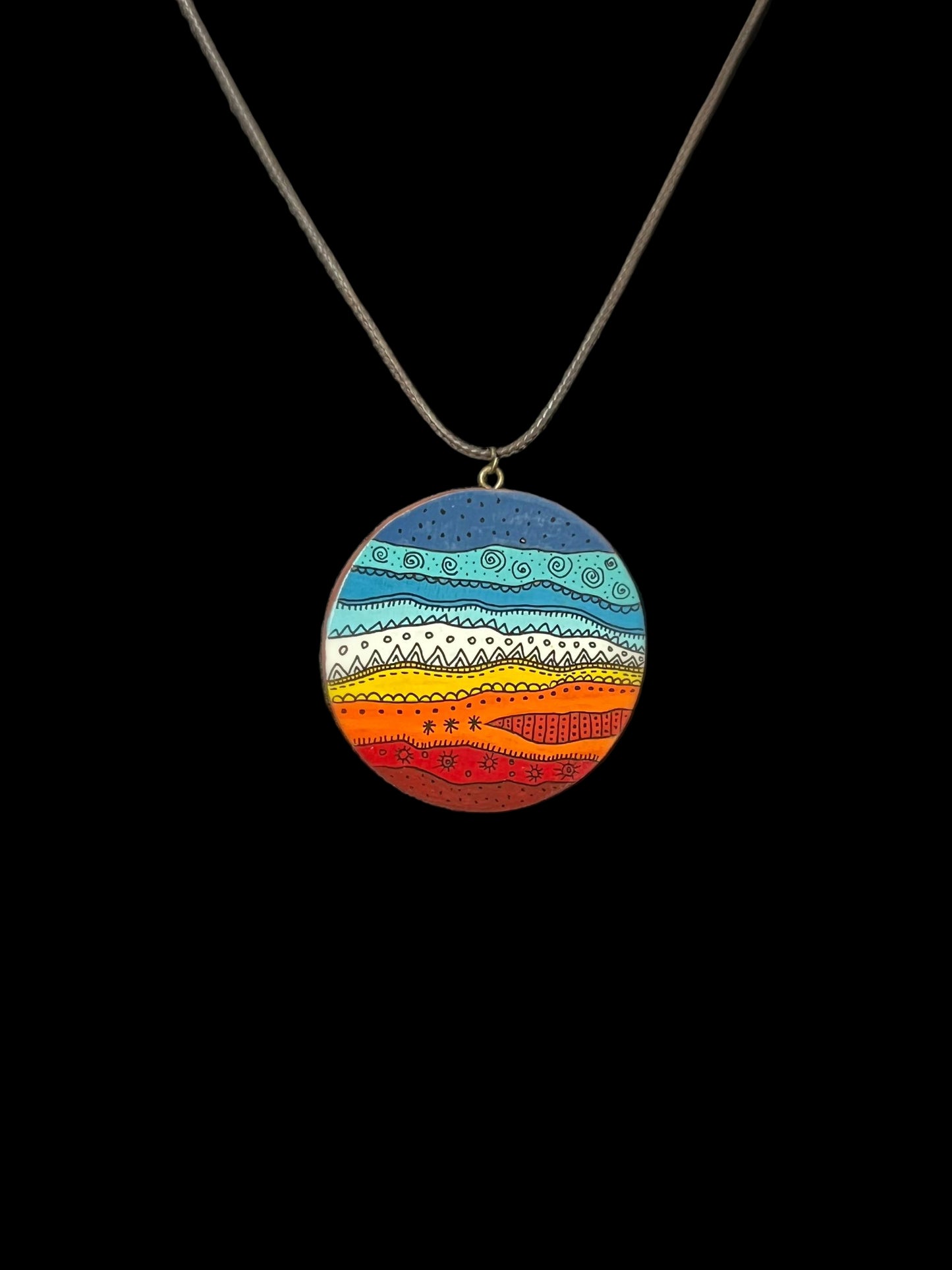 Colorful circular pendant on a chain 