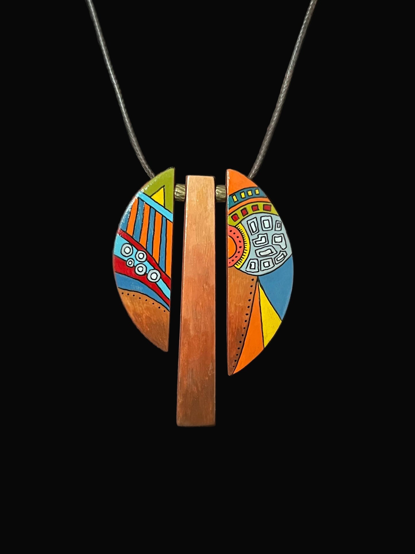Colorful pendant necklace on a black background